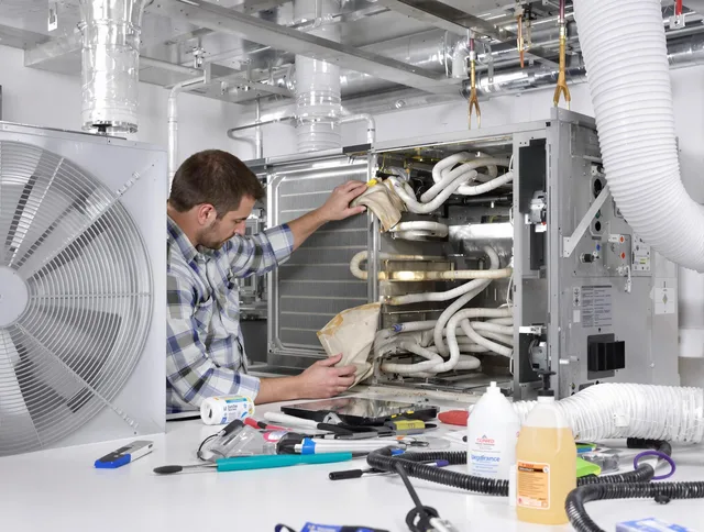 Swansea Air Duct Cleaning specialist performing precision AC coil cleaning in Swansea