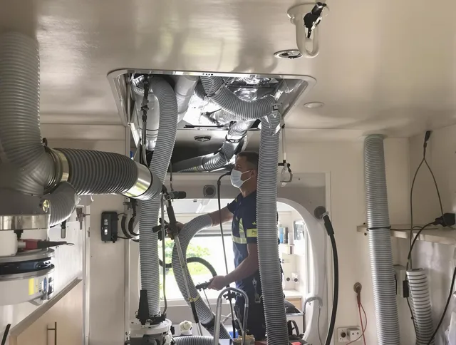 Swansea Air Duct Cleaning specialist performing precise mobile home duct cleaning in Swansea