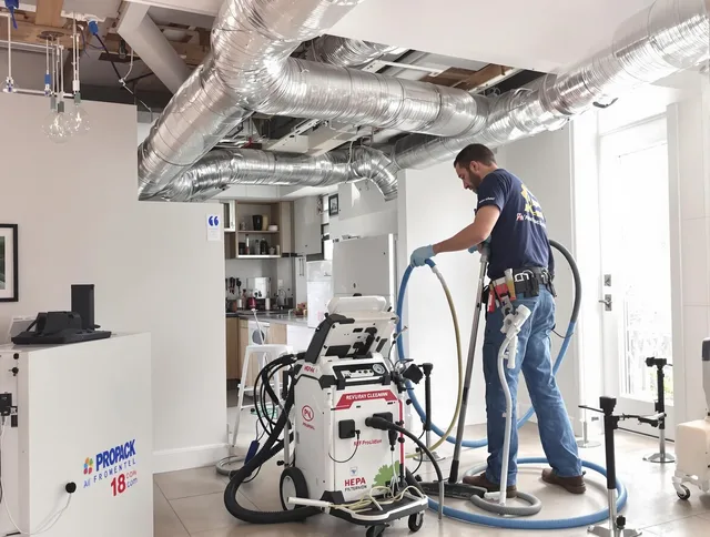 Swansea Air Duct Cleaning technician performing advanced pure duct cleaning with specialized equipment in Swansea