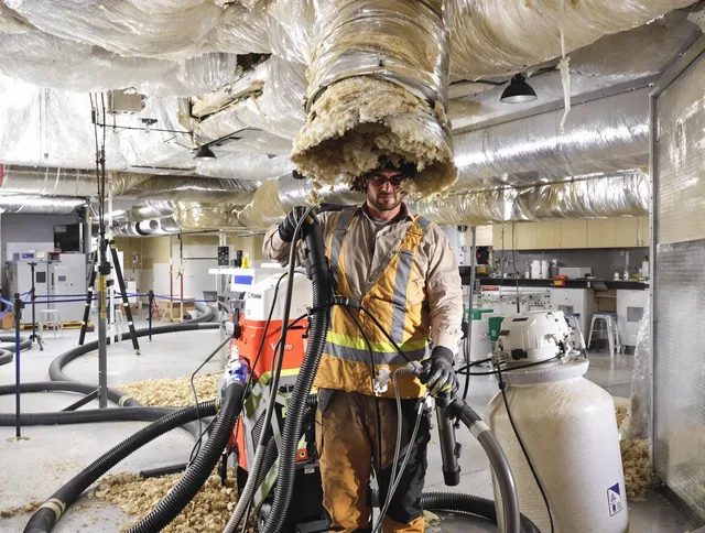 Professional vacuum insulation removal by Swansea Air Duct Cleaning expert in Swansea